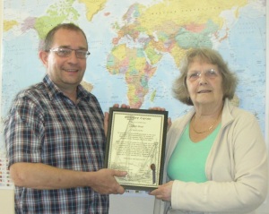 Paul Gray presented with his certificate by Jean Gray, Committee Member
